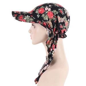 Floral headscarf hat with rose pattern and visor showing side view of the strap detail