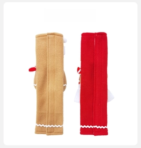 Back view of plush Christmas gingerbread and red handle covers with wavy trim