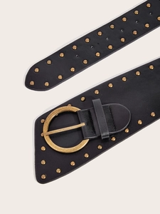 Detail of punk leather belt featuring vintage gold round buckle and studded texture