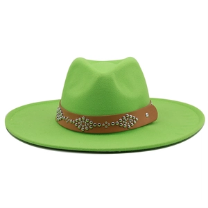 Detail of neon green wool fedora hat featuring a brown leather studded decorative band