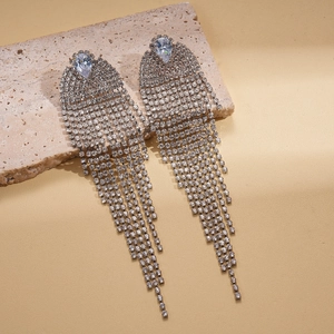 Luxurious silver tassel earrings with teardrop zirconia and fringe dangles on stone