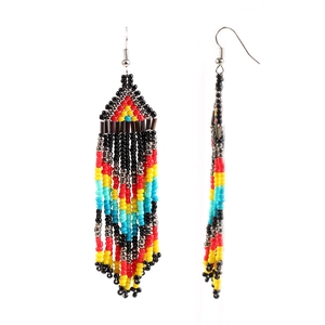 Detailed view of handmade beaded tassel earrings with bohemian geometric patterns