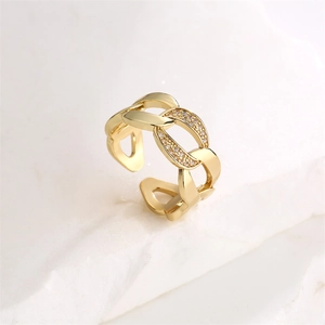 Macro detail of gold-plated cuban chain ring with micro-paved sparkling zircon stones