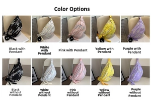 Detail view of colorful striped crossbody bags in black white pink yellow and purple