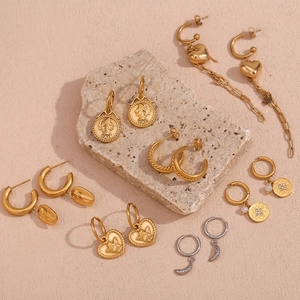 Detailed collection of vintage 18K gold plated earrings with heart and coin charms