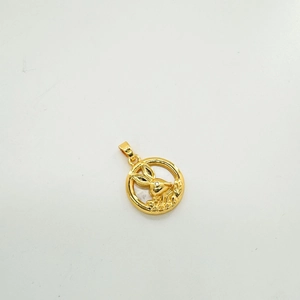 Macro shot of 18K gold-plated round pendant with rabbit motif for DIY jewelry