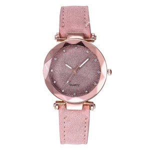 Macro detail of starry pink quartz watch with rose gold case and rhinestone markers