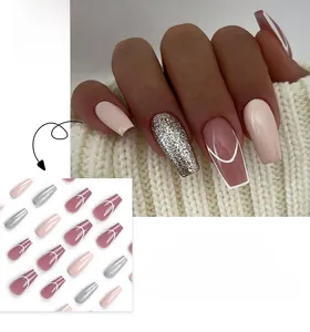 Close-up of pink and white French press-on nails with silver glitter in short coffin shape