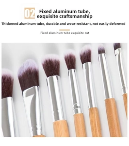Close-up of bamboo handle makeup brushes with thick silver aluminum tubes and soft bristles