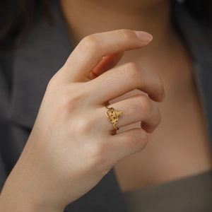 Gold hollowed pumpkin ring in stainless steel for Halloween, worn on finger