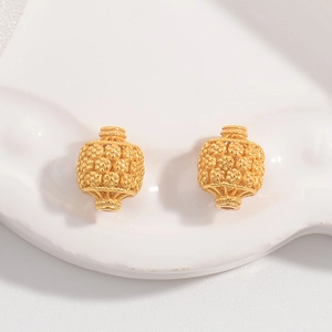 Vintage hollow lantern bead in gold finish with embossed floral textures for DIY jewelry