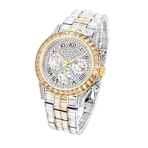 Close-up of gold and silver luxury watch featuring diamond encrusted bezel and Roman dial