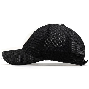 Detail view of the breathable black mesh fabric texture on this outdoor baseball cap