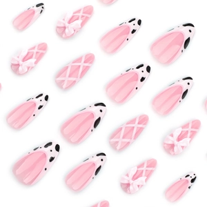 Pink French cow print press-on nails with 3D bows and ballet ribbon art in coffin shape