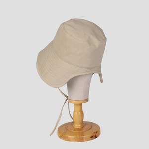 Detail showing beige sun hat wide brim with drawstring on professional mannequin stand