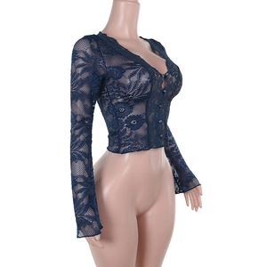 Detail of navy blue lace fabric and V-neckline on a slim-fit long-sleeve cardigan