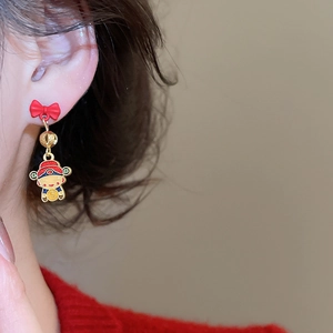Macro shot of God of Wealth drop earring with red bow and detailed enamel finish