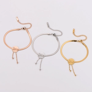 Three stainless steel LOVE snake chain bracelets in gold, silver, and rose gold with tassels