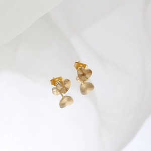 Minimalist 18K gold plated heart stud earrings with radial texture on white fabric