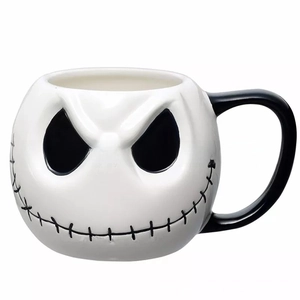 Macro detail of Jack Skellington skull mug featuring smooth white ceramic and black details