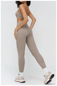 Detail view of high-waist taupe yoga set showing side fit and premium matte texture