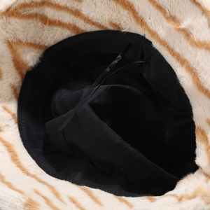 Interior view of tiger print plush bucket hat with black lining and adjustable drawstring