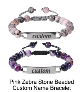 Detailed view of pink zebra stone beaded bracelet with custom engraved steel name plate
