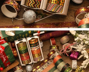 Close-up of festive Christmas washi tape set with gold foil gingerbread and tree patterns