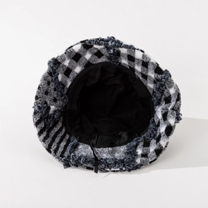 Classic plaid wool bucket hat with frayed edges and adjustable inner strap detail