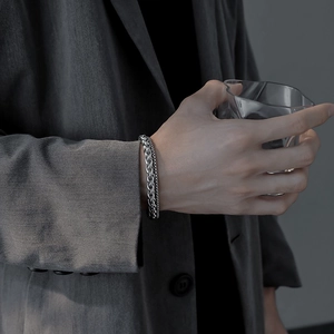 Polished silver titanium steel woven chain bracelet for men worn with a suit