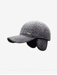 Detail of grey winter baseball cap showing textured fabric and foldable ear flaps