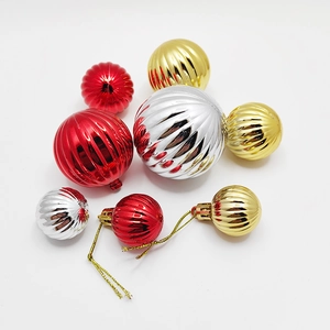 Set of striped Christmas ball ornaments in red, gold, and silver for tree decoration