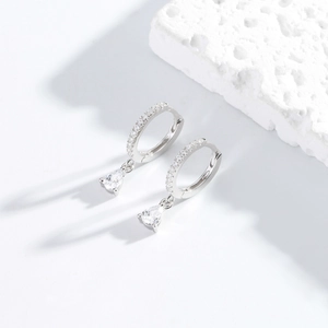 Elegant S925 sterling silver drop earrings with micro-set diamonds on a white rock base