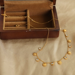 18k gold plated stainless steel necklace with shell pendants and zircon stones on satin
