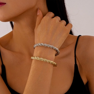 Minimalist twisted metal bangle bracelets in gold and silver finish for women