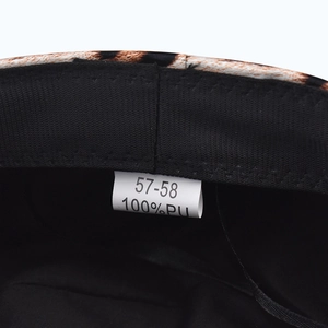 Detail view of the black PU military hat interior with 100% PU material and size label