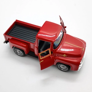 Detailed top view of red vintage alloy pickup truck model with openable doors