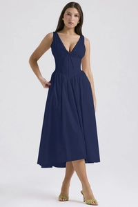 Detailed view of deep V-neckline and waist cut of navy blue sleeveless maxi dress