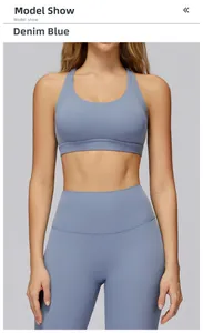 Front view of denim blue sports bra and high-waist yoga pants in soft knitted texture