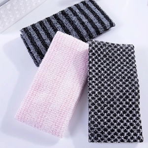 Set of three textured long exfoliating back scrubbers in gray, pink, and black patterns
