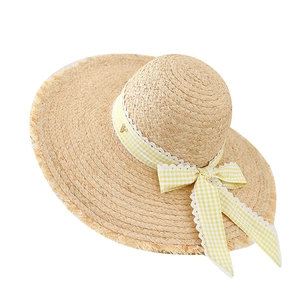 French woven raffia sun hat with yellow plaid ribbon and wide fringed brim for beach