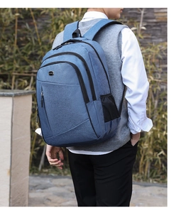 Blue Oxford fabric backpack with side mesh pockets and multiple storage compartments