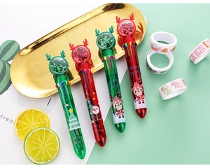 Close-up of Christmas 10-color ballpoint pens with cartoon deer and sequin sand globes