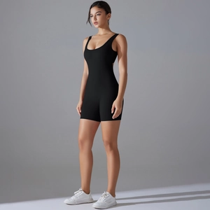 Close-up of black sleeveless bodysuit with high-stretch fabric and V-waist gym shorts detail