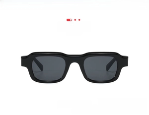 Detailed front view of rectangular black frame sunglasses with dark grey lenses