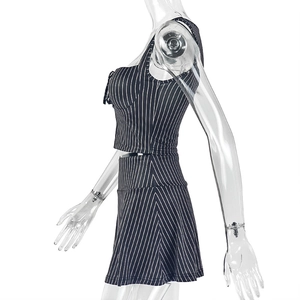 Side view of striped two-piece set featuring a cropped tank top and high waist skirt