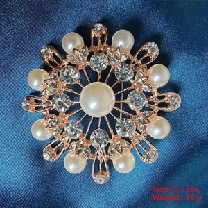 Detailed macro view of 5.1cm camellia brooch with luxury pearls and rose gold finish