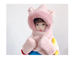 Close-up of pink plush texture and warm faux rabbit fur on the girl's winter hat set