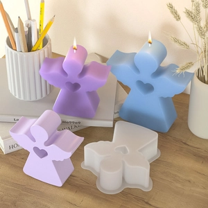 3D angel candle silicone mold set for DIY epoxy resin ornaments on wooden table