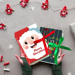 Exquisite Christmas chocolate gift boxes in magic book design with festive ribbons